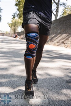 Бандаж для коленного сустава Thuasne Novelastic 0270 с перекрестными ремнями и боковыми ребрами жесткости ДЛЯ ЖЕНЩИН И МУЖЧИН